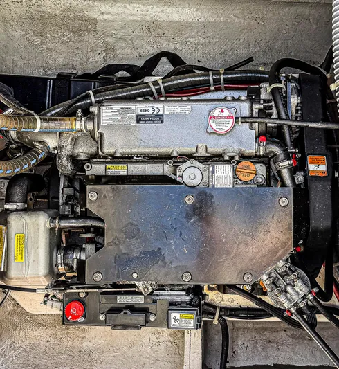 Blue Pearl Too Yacht Photos Pics Engine compartment of a 2017 Lagoon 42 catamaran, showcasing mechanical components and wiring.