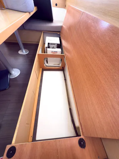 Blue Pearl Too Yacht Photos Pics Interior storage compartment of a 2017 Lagoon 42 catamaran, showcasing under-seat space.