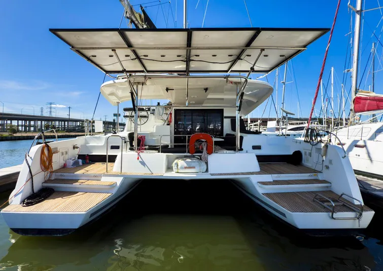 Blue Pearl Too Yacht Photos Pics 2017 Lagoon 42 catamaran docked, showcasing spacious deck and modern design.