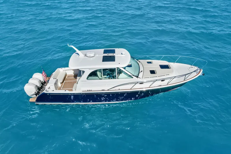 Jenny B Yacht Photos Pics 2021 Hinckley Sport Boat 40 X cruising on clear blue water.