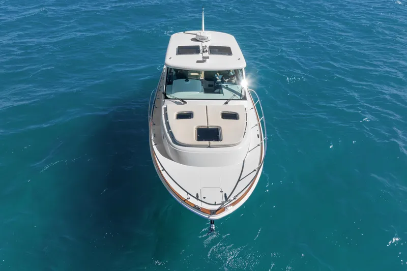 Jenny B Yacht Photos Pics 2021 Hinckley Sport Boat 40 X cruising on clear blue water.