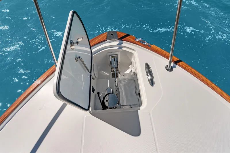 Jenny B Yacht Photos Pics Hinckley Sport Boat 40 X 2021 anchor compartment open on blue ocean water.