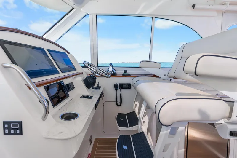 Jenny B Yacht Photos Pics Interior of 2021 Hinckley Sport Boat 40 X, featuring modern helm and seating.