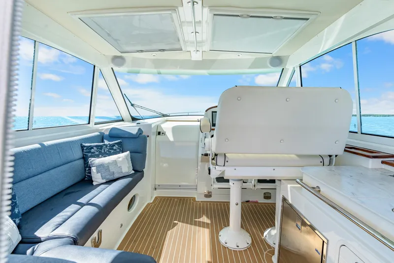 Jenny B Yacht Photos Pics Interior of 2021 Hinckley Sport Boat 40 X with blue seating and ocean view.
