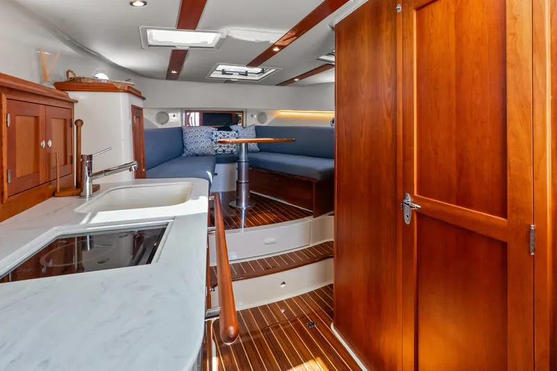 Jenny B Yacht Photos Pics Interior of 2021 Hinckley Sport Boat 40 X with wood finishes and modern amenities.