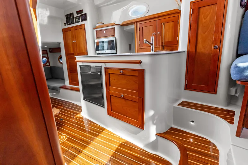 Jenny B Yacht Photos Pics Luxurious interior of 2021 Hinckley Sport Boat 40 X with elegant wood finishes.