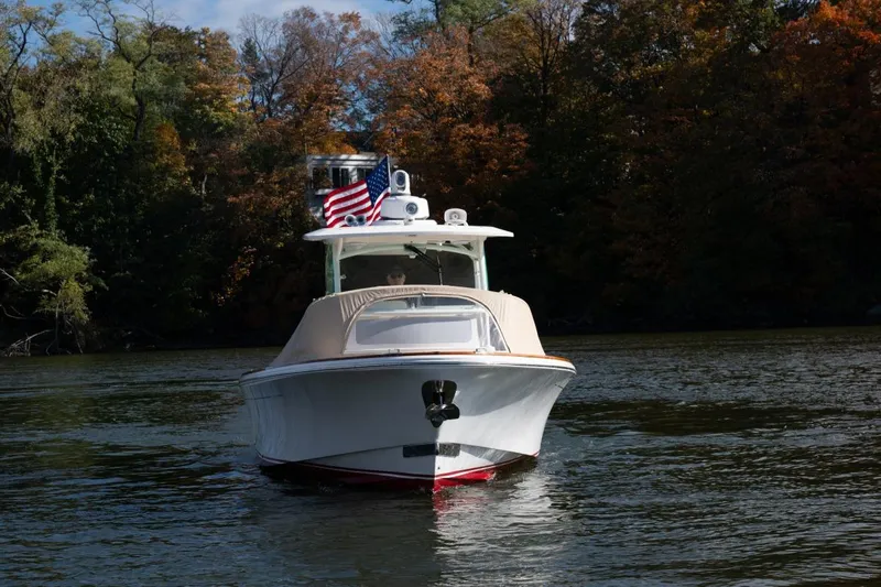 Minnow Yacht Photos Pics 2016 Hunt Yachts 32 Center Console on a scenic lake with autumn foliage.