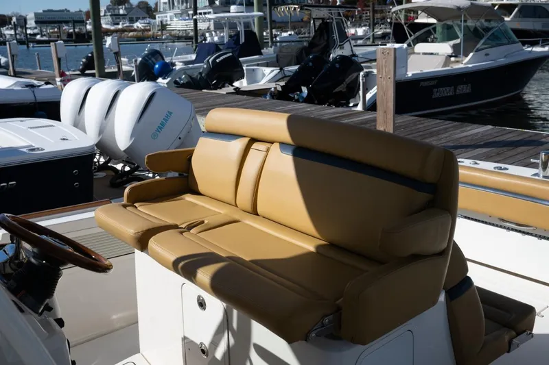 Minnow Yacht Photos Pics 2016 Hunt Yachts 32 Center Console with tan seating at a marina.