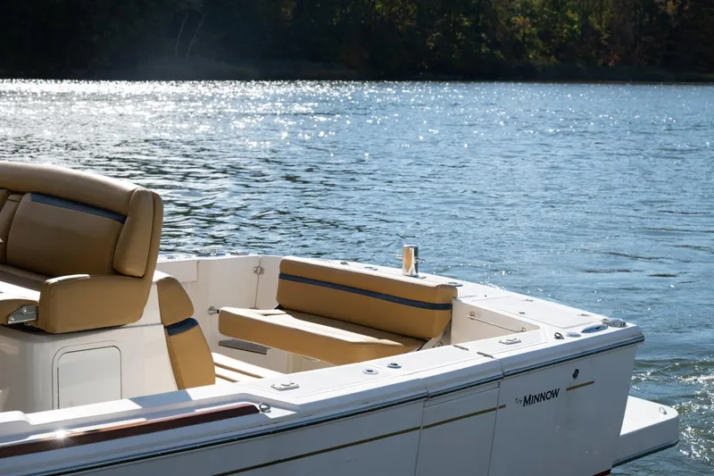 Minnow Yacht Photos Pics 2016 Hunt Yachts 32 Center Console on serene water, featuring tan seating.