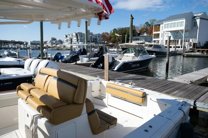 Minnow Yacht Photos Pics 2016 Hunt Yachts 32 Center Console docked at a marina with scenic waterfront views.
