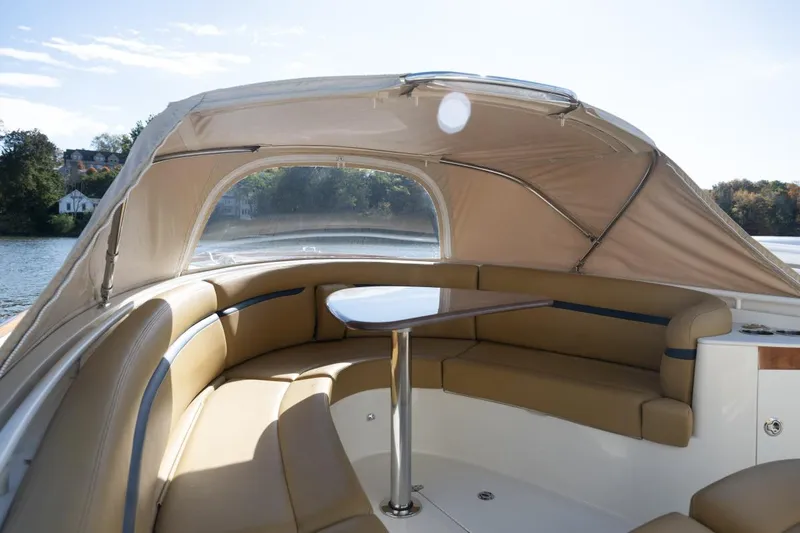 Minnow Yacht Photos Pics 2016 Hunt Yachts 32 Center Console with tan seating and canopy on a sunny day.
