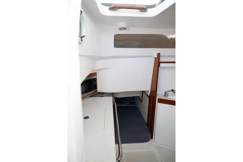 Minnow Yacht Photos Pics Interior cabin of 2016 Hunt Yachts 32 Center Console, featuring a compact and modern design.