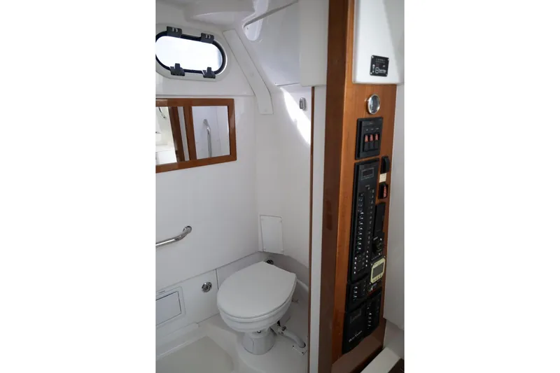 Minnow Yacht Photos Pics 2016 Hunt Yachts 32 Center Console interior bathroom with toilet and control panel.
