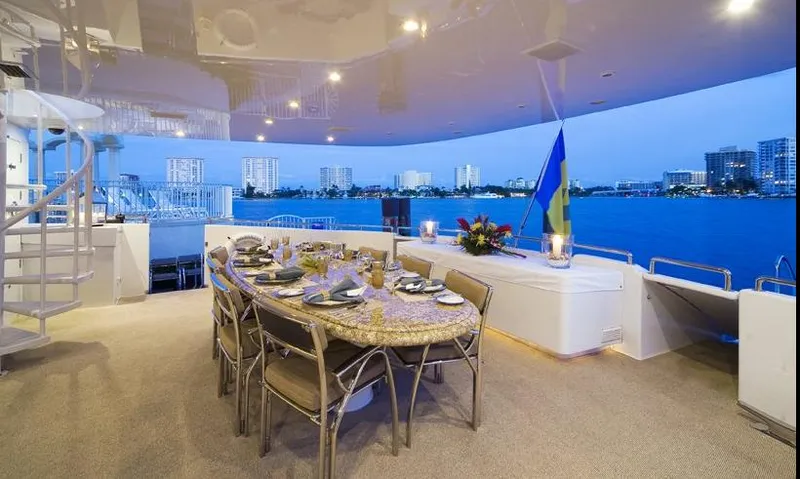 Moonraker Yacht Photos Pics Luxurious dining area on 1992 Norship Motoryacht with city skyline view.