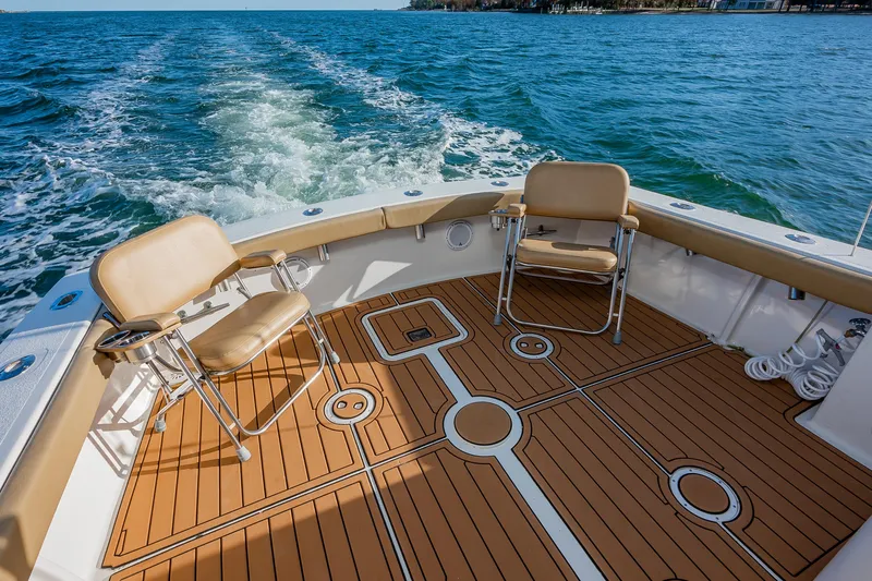 Moby Yacht Photos Pics 1987 Custom Carolina Island Boatworks 34 Express, featuring spacious deck and comfortable seating.