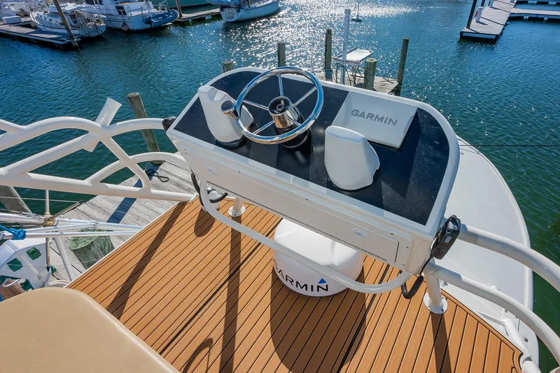 Moby Yacht Photos Pics Helm of 1987 Custom Carolina Island Boatworks 34 Express with Garmin equipment, docked at marina.