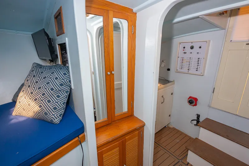 Moby Yacht Photos Pics Interior of 1987 Custom Carolina Island Boatworks 34 Express, featuring seating, cabinetry, and control panel.