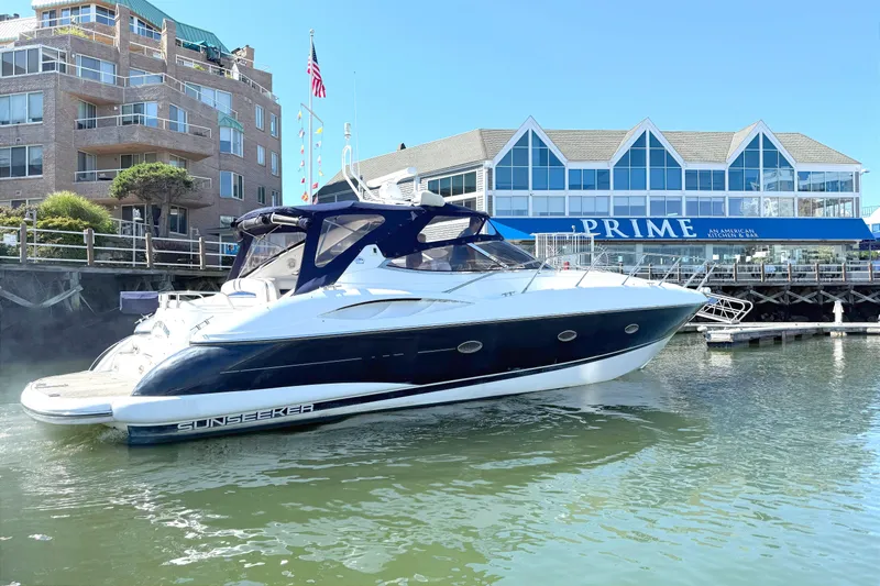  Yacht Photos Pics Sunseeker Camargue 44 yacht docked near waterfront buildings, 2002 model.