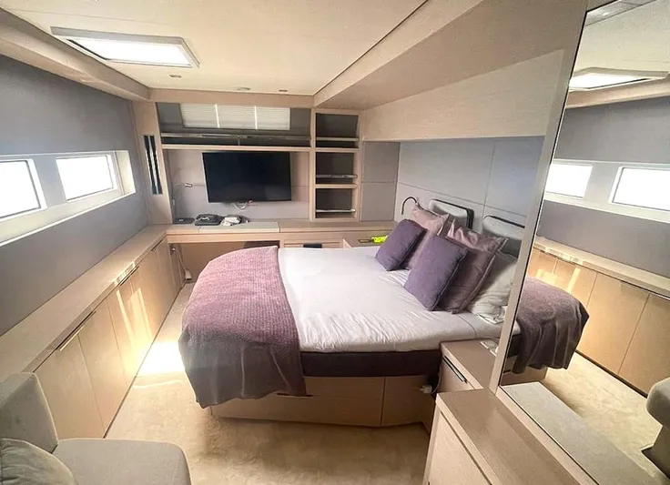Elora Yacht Photos Pics Luxurious bedroom interior of 2023 Lagoon 55 yacht with modern furnishings.