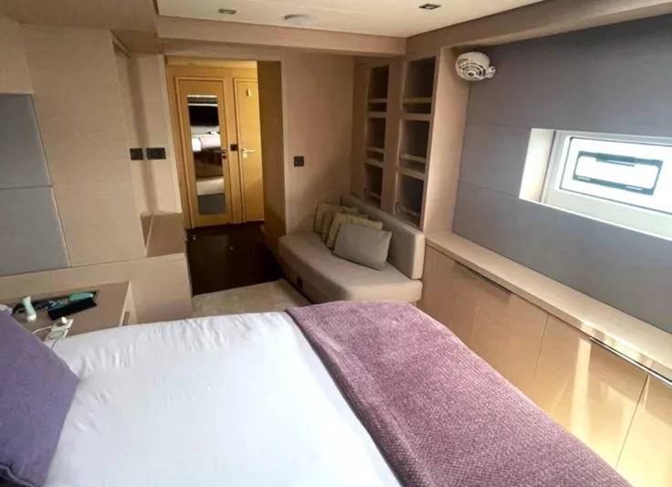 Elora Yacht Photos Pics Luxurious interior of 2023 Lagoon 55 yacht with cozy bedroom and modern design.