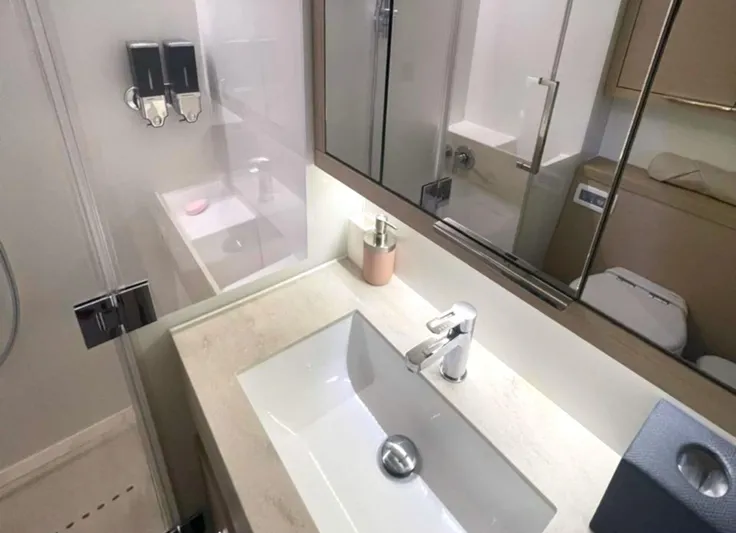 Elora Yacht Photos Pics Modern bathroom in 2023 Lagoon 55 yacht with sleek sink and mirror.