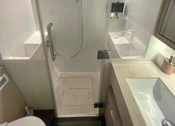 Elora Yacht Photos Pics Modern bathroom in 2023 Lagoon 55 yacht with shower and sleek fixtures.