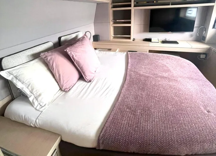 Elora Yacht Photos Pics Luxurious bedroom in 2023 Lagoon 55 yacht with cozy bedding and modern decor.