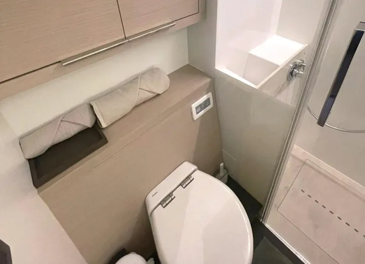 Elora Yacht Photos Pics Modern bathroom in 2023 Lagoon 55 yacht with sleek design and compact layout.