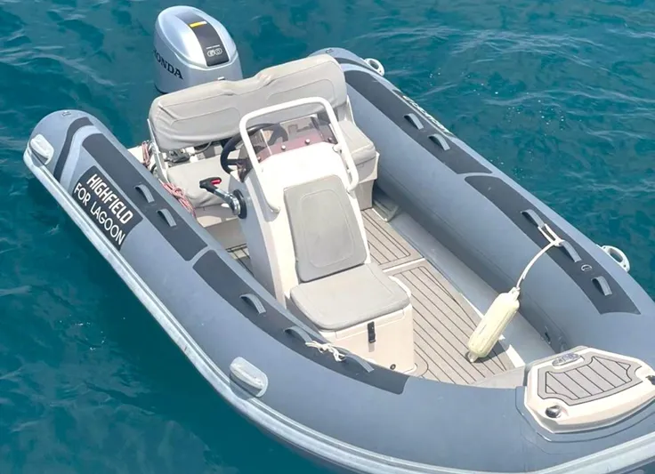 Elora Yacht Photos Pics Highfield inflatable boat for Lagoon 55, 2023 model, on clear blue water.