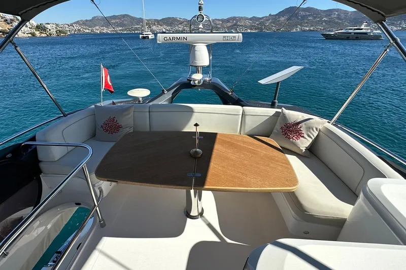  Yacht Photos Pics 2023 Princess F45 yacht deck with seating, table, and ocean view.