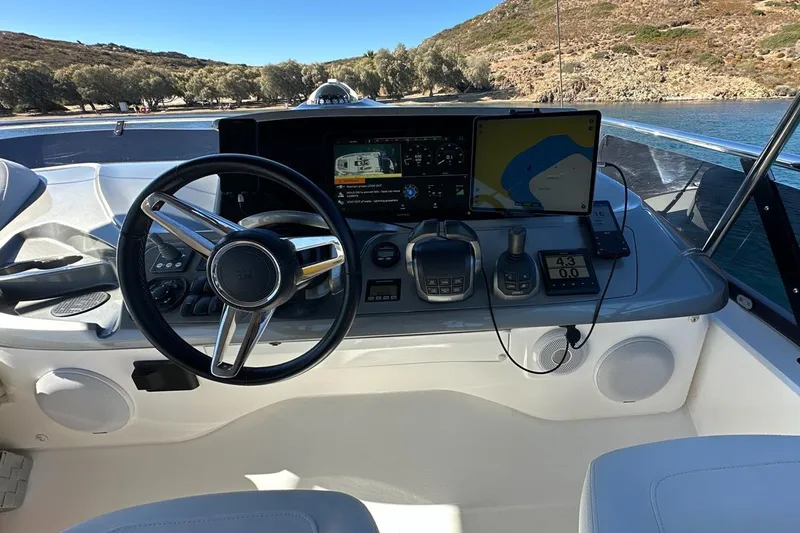  Yacht Photos Pics 2023 Princess F45 yacht helm with modern navigation system and steering wheel.