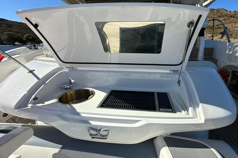  Yacht Photos Pics 2023 Princess F45 yacht outdoor kitchenette with sink and grill.