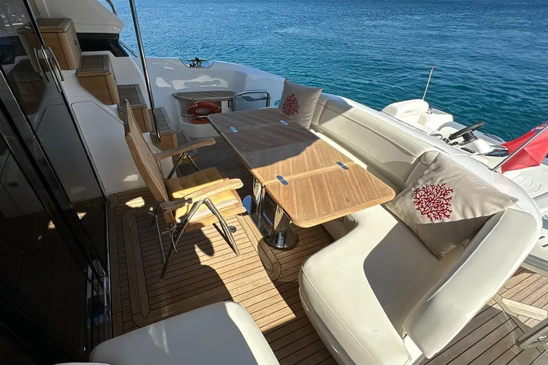  Yacht Photos Pics Luxurious 2023 Princess F45 yacht deck with elegant seating and ocean view.