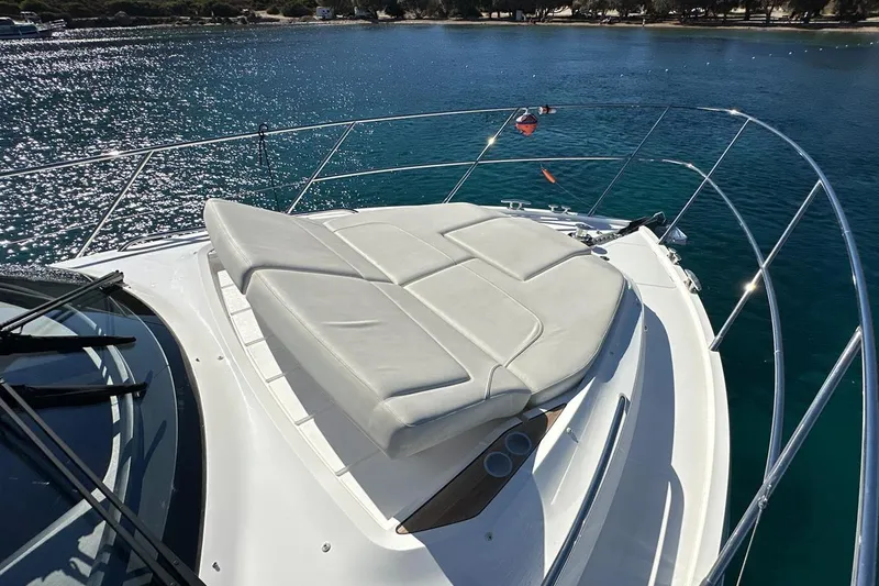  Yacht Photos Pics 2023 Princess F45 yacht with sunbed on deck, overlooking serene blue waters.