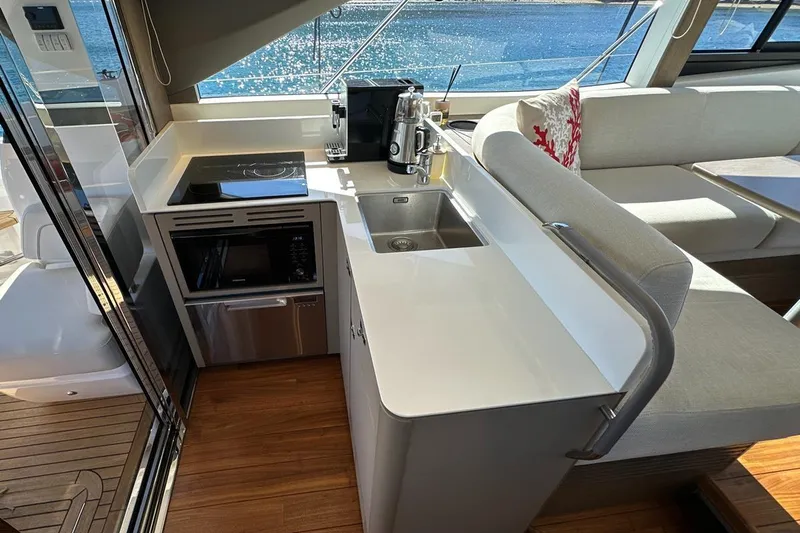  Yacht Photos Pics Modern kitchen in 2023 Princess F45 yacht with sleek countertops and appliances.