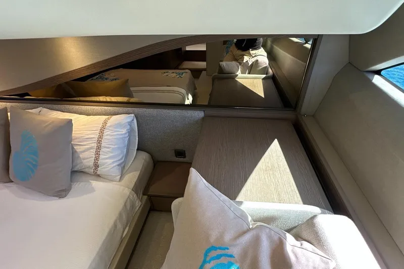  Yacht Photos Pics Luxurious interior of 2023 Princess F45 yacht with elegant bedding and modern design.