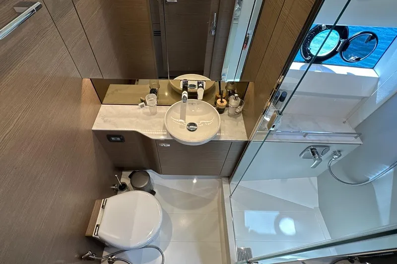  Yacht Photos Pics Luxurious bathroom in 2023 Princess F45 yacht with modern fixtures and elegant design.