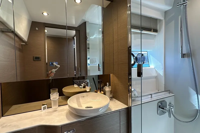  Yacht Photos Pics Luxurious bathroom interior of 2023 Princess F45 yacht with modern fixtures and elegant design.