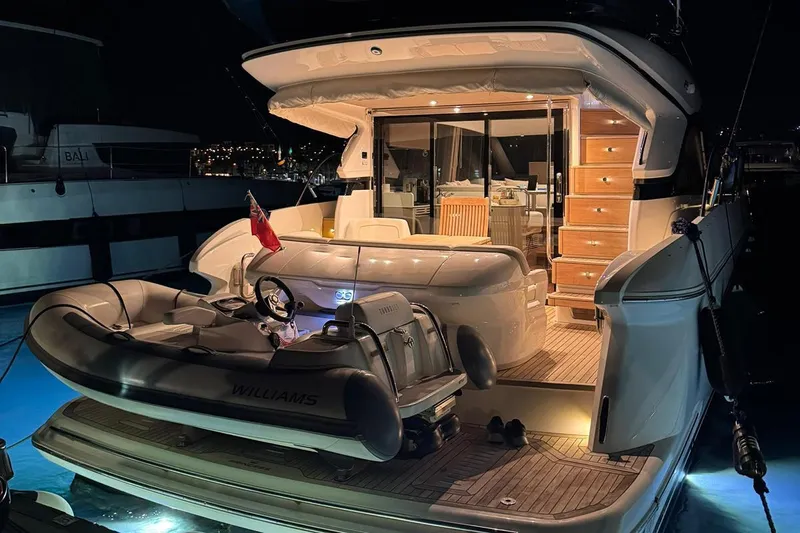  Yacht Photos Pics Luxurious 2023 Princess F45 yacht at night, featuring elegant interior and exterior lighting.