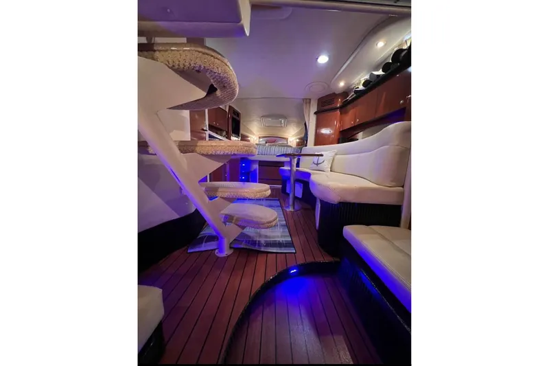  Yacht Photos Pics Luxurious interior of 2005 Sea Ray Sundancer 320 yacht with elegant seating and ambient lighting.