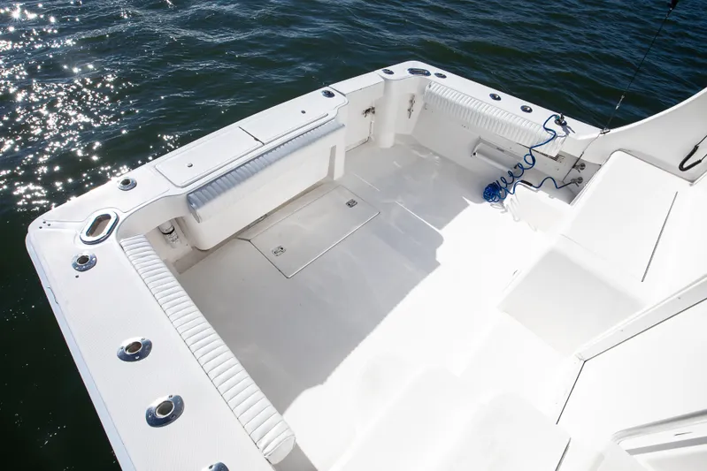 Jenn-a Yacht Photos Pics 2007 Luhrs Tournament 360 Open boat deck with seating and rod holders.