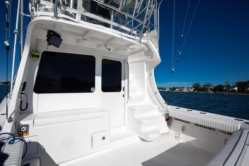Jenn-a Yacht Photos Pics 2007 Luhrs Tournament 360 Open yacht deck with seating, steps, and ocean view.