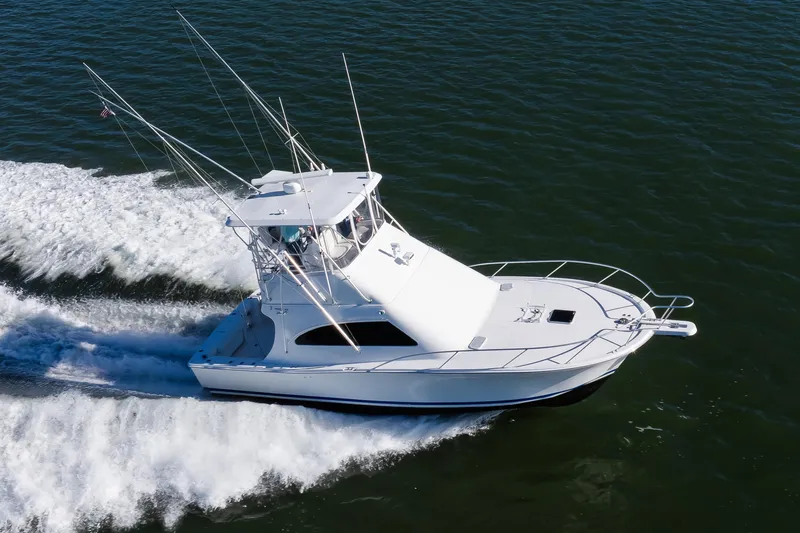 Jenn-a Yacht Photos Pics 2007 Luhrs Tournament 360 Open boat cruising on open water, aerial view.
