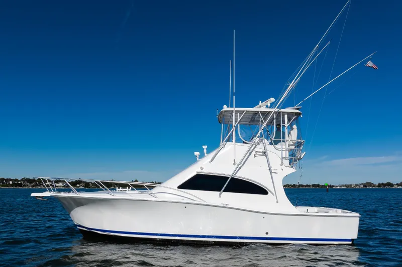 Jenn-a Yacht Photos Pics 2007 Luhrs Tournament 360 Open yacht on calm water under clear blue sky.