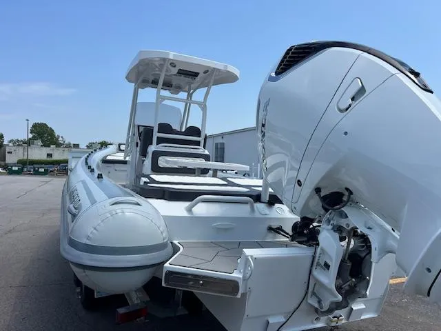 Sport 800 Yacht Photos Pics 2024 Highfield Sport 800 boat with powerful outboard motor, docked outdoors.