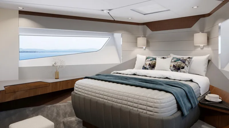  Yacht Photos Pics Luxurious bedroom interior of 2026 Fairline Squadron 58 yacht with ocean view.