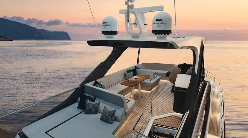  Yacht Photos Pics 2026 Fairline Squadron 58 yacht at sunset, featuring elegant deck seating and modern design.