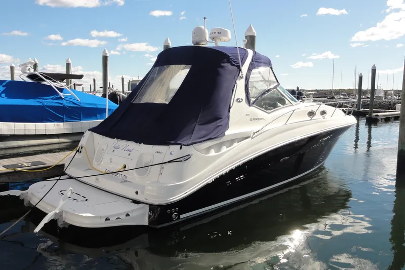  Yacht Photos Pics 2007 Sea Ray 320 Sundancer docked at marina under clear skies.