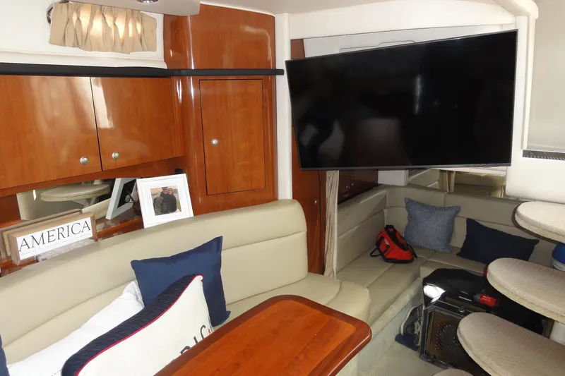  Yacht Photos Pics Interior of 2007 Sea Ray 320 Sundancer with cozy seating and large TV.