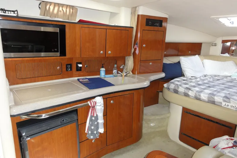  Yacht Photos Pics 2007 Sea Ray 320 Sundancer cabin with kitchenette and cozy sleeping area.